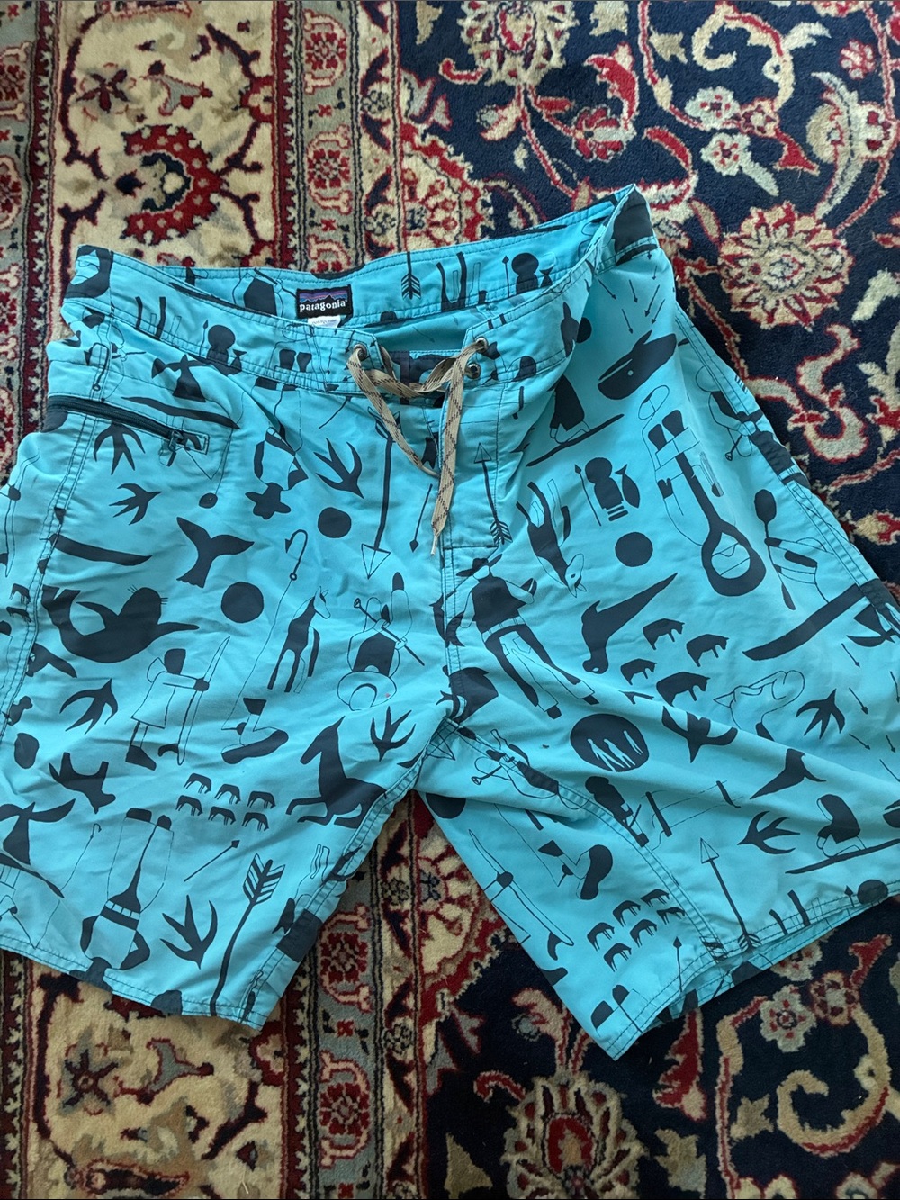 Patagonia Teal Swim Board Shorts with Dark Graphic Print